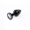 Czarny plug analny z białym diamentem